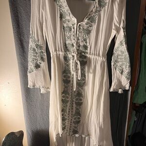 Gorgeous high-low dress, fastened with snaps down the entire front of dress.